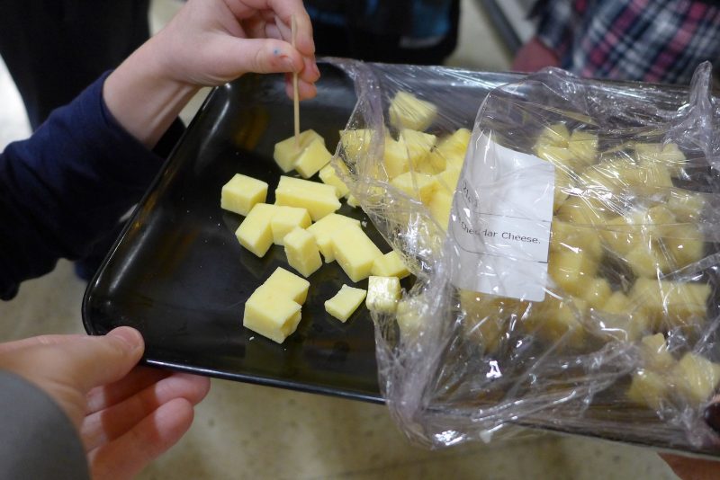 children sampling cheese at the Tesco farm to fork trail