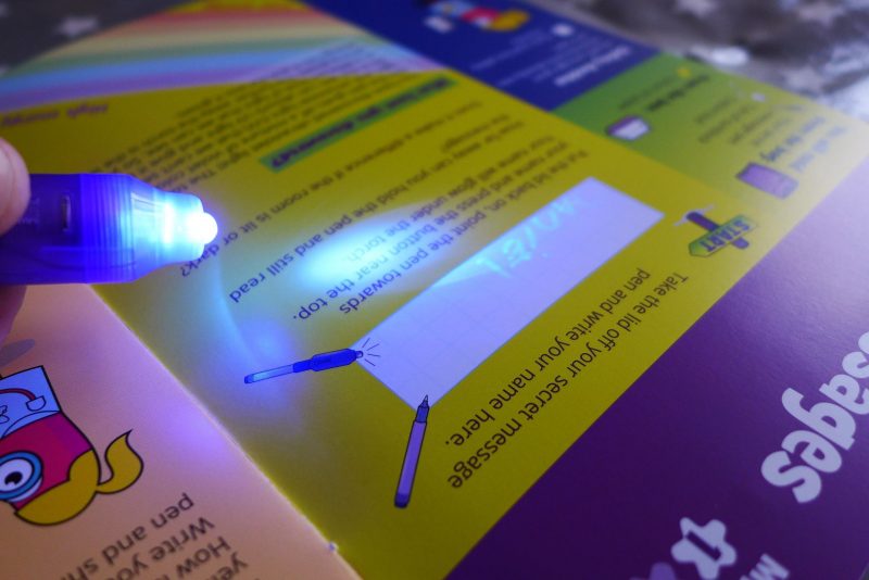 lettterbox lab - children experimenting with UV pens to make secret messages