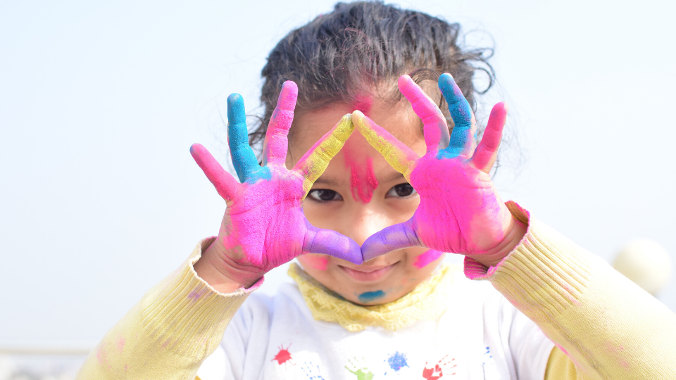 child with painted hands